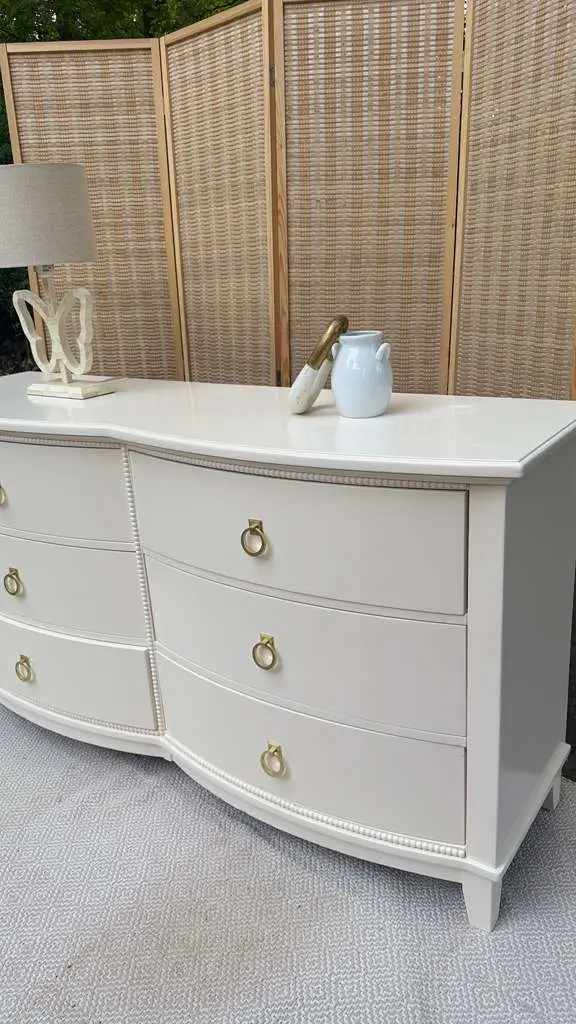 Cream bow-front dresser with ring pulls